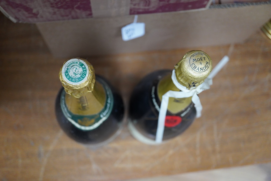 A Magnum bottle of Moet & Chandon champagne and a Magnum Canard-Duchene